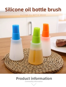Close-up of three colorful silicone oil bottles with brushes and scale markings