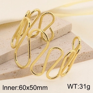 Detail shot of wavy gold stainless steel cuff bracelet with size 60x50mm and 31g weight