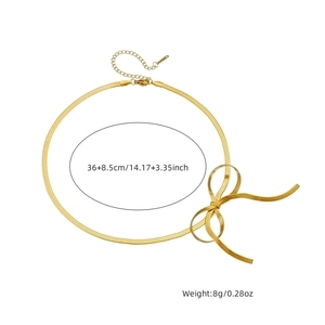 Elegant gold plated stainless steel snake chain necklace with bow detail on white background