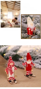 Detail of handcrafted wooden Christmas ski figurines with cozy red and white knit textures