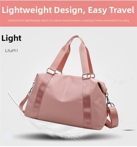 Pink waterproof travel duffel bag with detachable shoulder strap shown with light feathers
