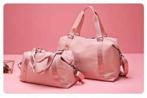 Close-up of pink fitness bags set with woven handles and adjustable shoulder straps