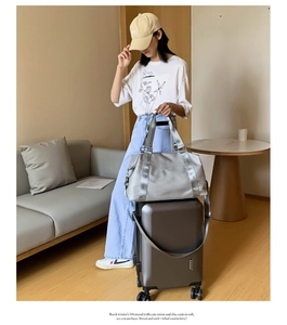 Gray waterproof fitness bag featuring a trolley sleeve for easy luggage attachment