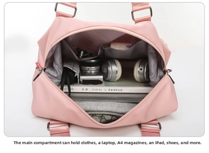Spacious interior of pink fitness bag showing compartments with laptop and gear