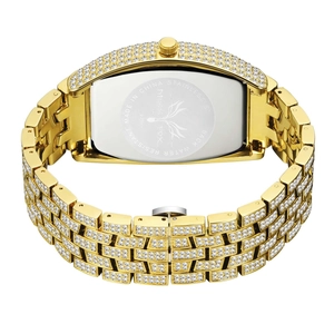 Detail of tonneau-shaped gold watch back with stainless steel casing and link strap