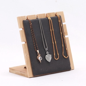 Bamboo necklace display stand with grey velvet board and five secure hooks for jewelry