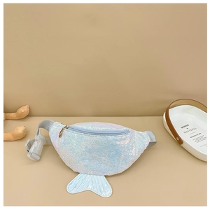 Detail of mermaid tail sequin waist bag with adjustable strap on beige background