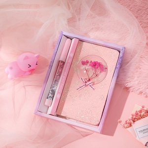 Pink mermaid stationery gift set with sequin notebook, glitter pen, and dried flowers