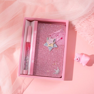 Pink mermaid stationery set with glitter notebook and liquid sand pen in a gift box