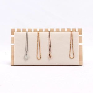 Bamboo wood necklace display stand with white velvet backing for jewelry presentation