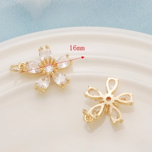 Macro view of 16mm 14K gold plated flower pendant with clear zircon stones for DIY jewelry