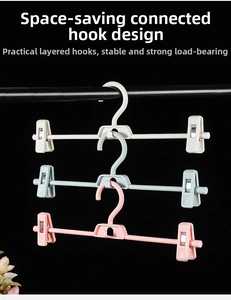 Adjustable plastic pants hanger with non-slip clips and space-saving vertical stacking hook