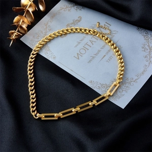 Chunky gold stainless steel clover jewelry set with thick Cuban chain on black satin