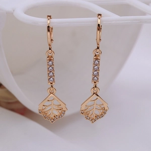 Detail of rose gold leaf drop earrings featuring hollow design and sparkling cubic zirconia