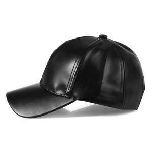 Detailed view of the black faux leather baseball cap with a classic six-panel structure