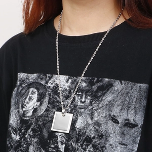 Square silver pendant necklace with CNC inlaid zircon on a rope chain, model shot