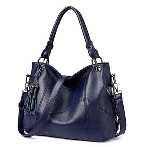 Large capacity navy blue soft leather handbag with tassel detail and crossbody strap