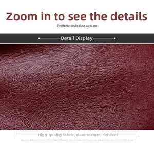 Macro shot of dark red litchi grain texture on high-quality leather handbag material