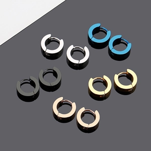 Detail showing multicolor stainless steel hoop earrings set on a reflective background