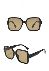 Detailed views of oversized square sunglasses with 3D textured temples and metallic rivets