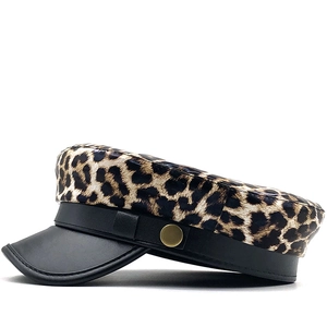 Leopard print newsboy cap with black leather brim and a gold buckle for women and men