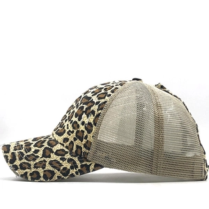 Close-up of leopard print baseball cap featuring breathable mesh and distressed brim detail
