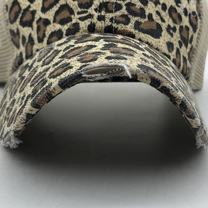 Distressed leopard print baseball cap with breathable mesh back and vintage torn brim design