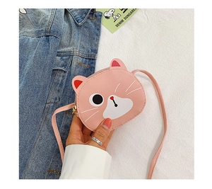 Detailed view of pink cat face cross-body bag with 3D ears and smooth zipper for girls