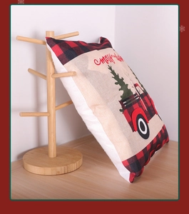 Detailed embroidery of red truck and Merry Christmas text on buffalo plaid pillowcase