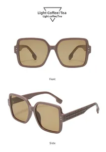 Detail view of large square tea sunglasses featuring vintage textured temple pattern