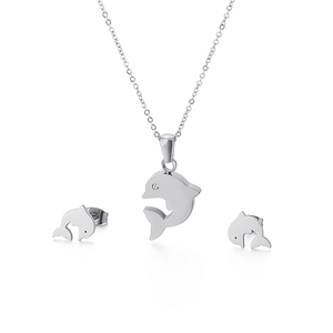 Polished silver dolphin necklace and earrings set with crystal eyes on white background
