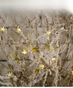Transparent Christmas angel pendants with gold wings and warm star LED string lights