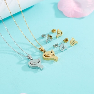 Golden and silver stainless steel fox necklace and stud earring set on blue background