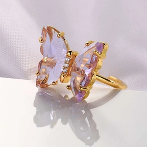 Elegant 18K gold butterfly ring with lavender crystal wings and sparkling zircon accents