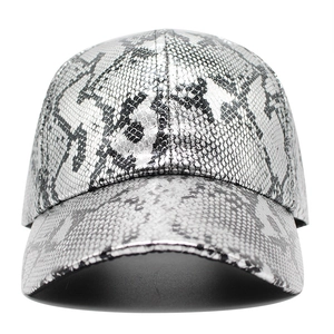 Detailed view of silver faux snakeskin texture and high-quality metallic finish on the baseball cap