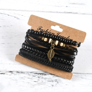 Set of four handmade braided leather bracelets with leaf charm and wooden beads on card