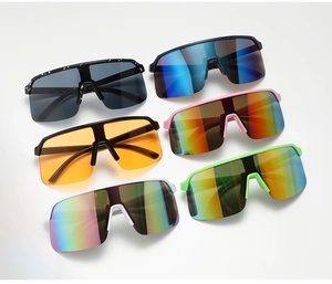 Detail view showing diverse colorful cycling sunglasses with premium PC frames and tinted lenses