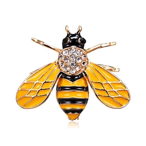 Elegant gold bee brooch with sparkling rhinestones and yellow enamel detailing on white background