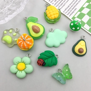 Assorted colorful resin charms featuring fruit, flowers and cloud shapes for DIY jewelry