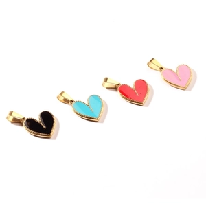 Set of four colorful enamel heart pendants with gold metal borders in a diagonal layout