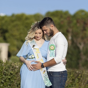 Mom To Be baby shower set with eucalyptus sash, gold headband, and Dad To Be badge