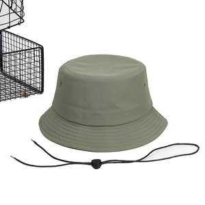 Detail of army green quick-dry bucket hat featuring adjustable black windproof chin strap
