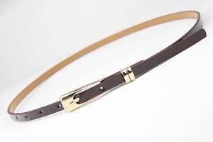 Detailed view of slim dark brown leather belt with elegant polished gold square buckle
