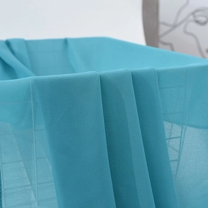 Lake blue chiffon hijab scarf with soft pleated texture and elegant pearl detailing