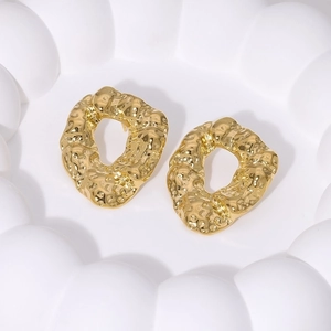 Irregular hammered 18K gold plated stainless steel earrings on a minimalist white tray