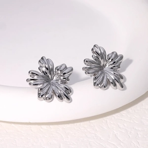 Elegant silver flower stud earrings in polished stainless steel with minimalist design