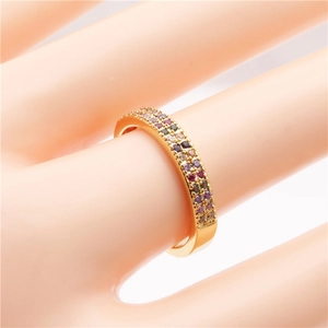 Main view of a golden ring with micro-pave rainbow cubic zirconia crystals