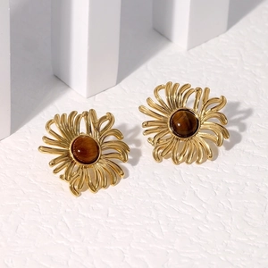 Detail of 18K gold-plated stainless steel flower studs with brown gemstone inlays