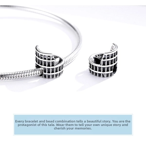 Macro detail of S925 sterling silver Colosseum beads on a vintage snake chain bracelet