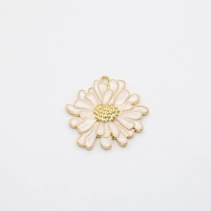 Detailed macro view of pink enamel daisy flower pendant charm with gold alloy edges